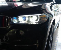 宝马新X5大灯升级GTR镀膜透镜氙气灯,欧卡改装网,汽车改装